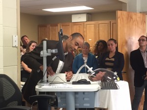 Dr. Ryan Mitchell, associate professor with The Sage Colleges’ Nutrition Science department, demonstrates how to use a metabolic heart monitor in the newly renovated Nutrition and Physical Assessment Laboratory
